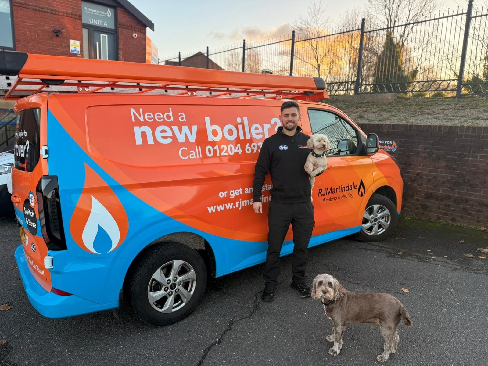 Owner of RJ Martindale Ryan stood next to one of the RJ Martindale vans.