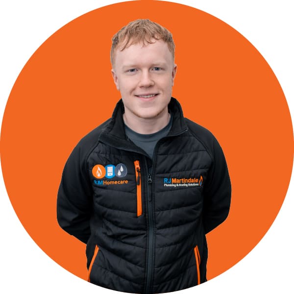 Half body photograph of Aaron, part of the RJ Martindale team.