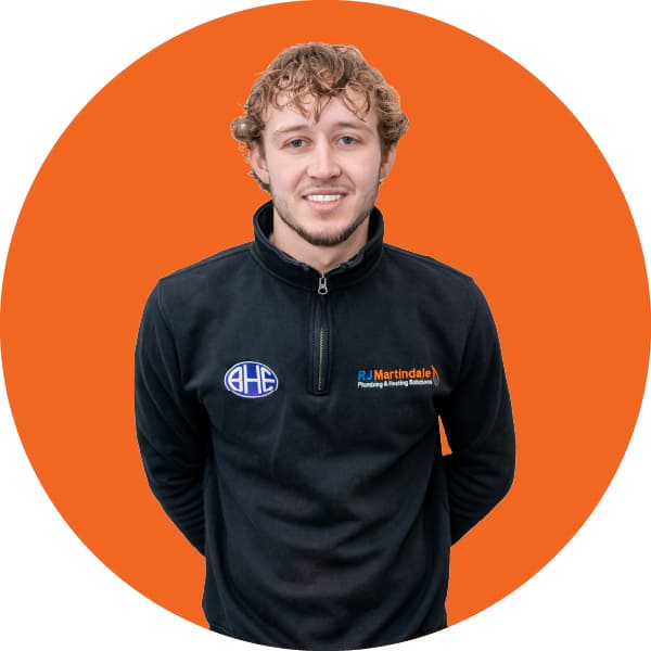 Half body photograph of Theo, part of the RJ Martindale team.