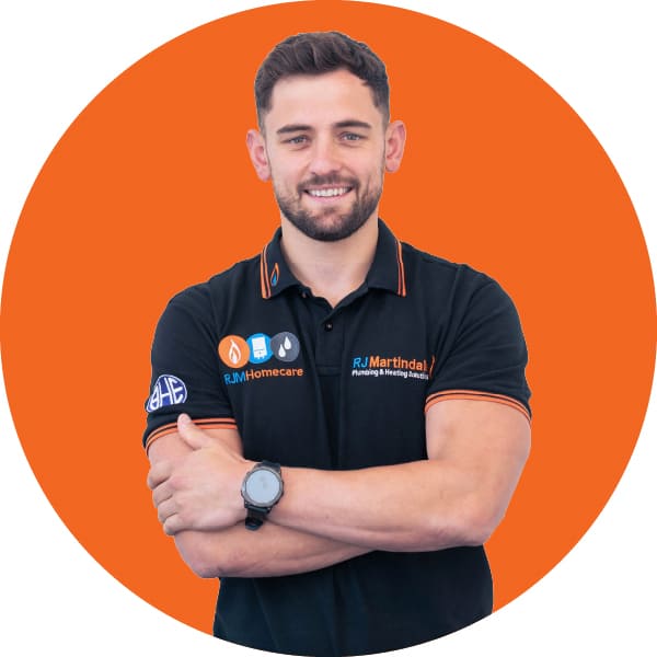 Half body photograph of Ryan, part of the RJ Martindale team.